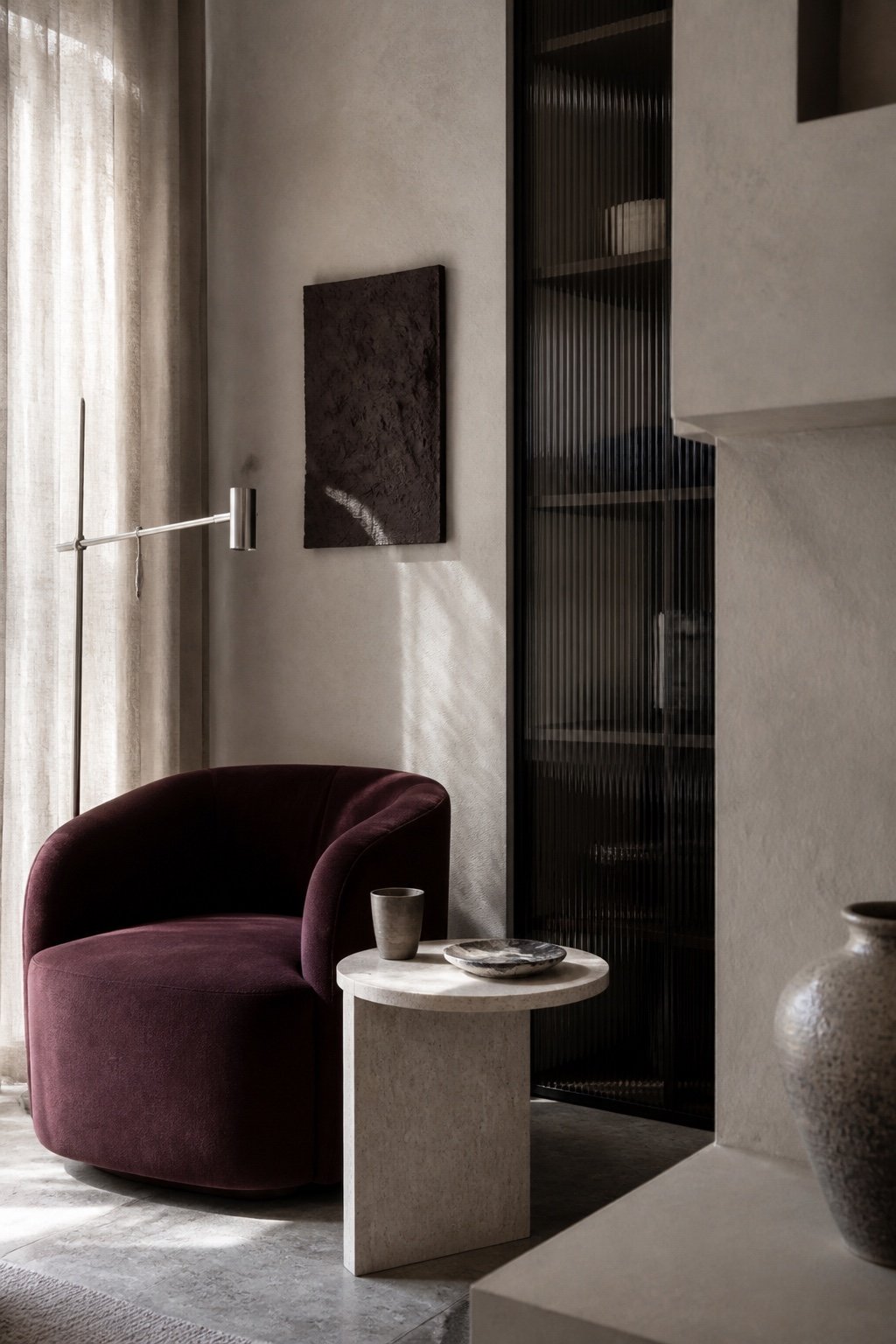 Interior study combining stone, textiles, glass and metal
